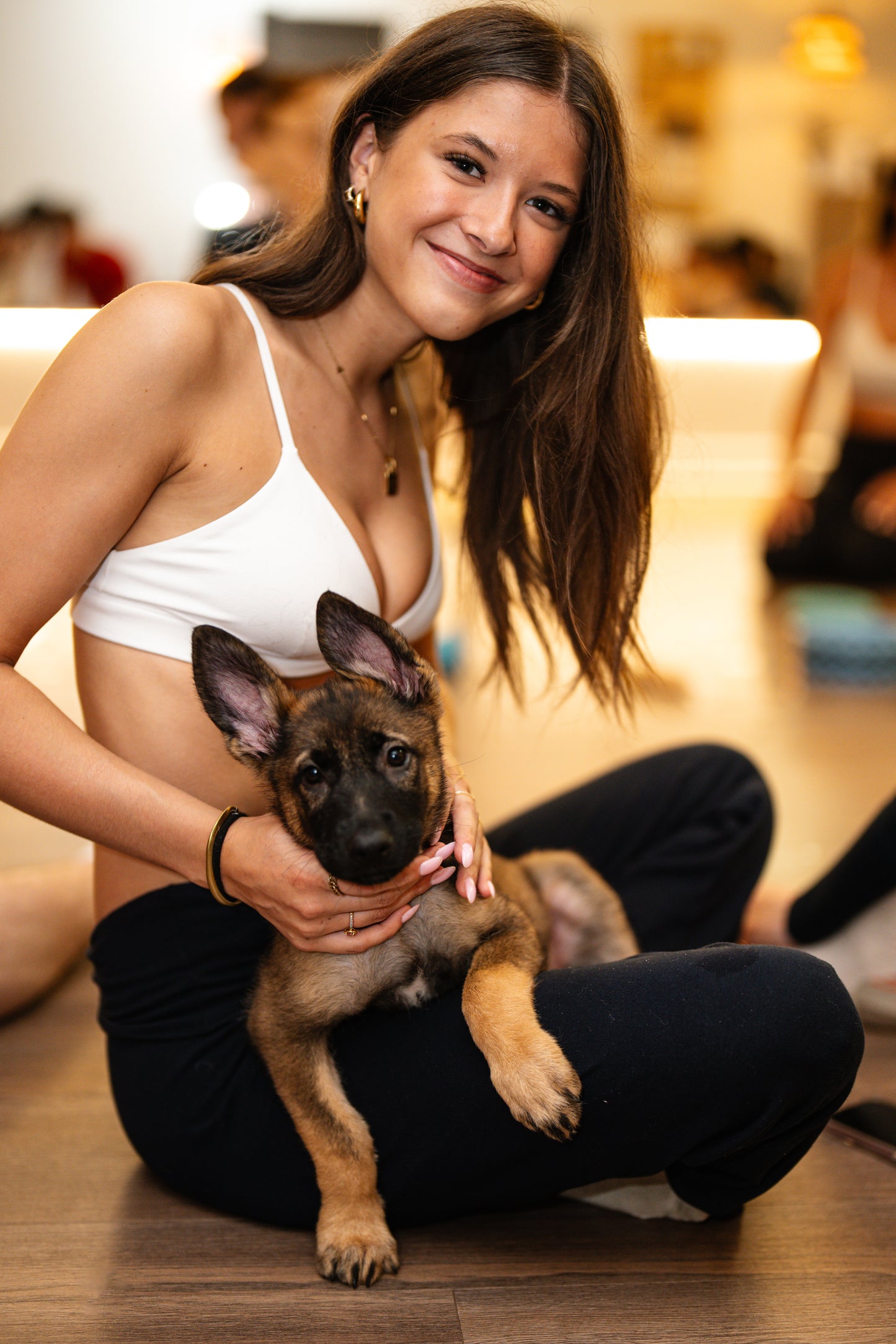 Participants and puppies during a puppy yoga session north of Montreal