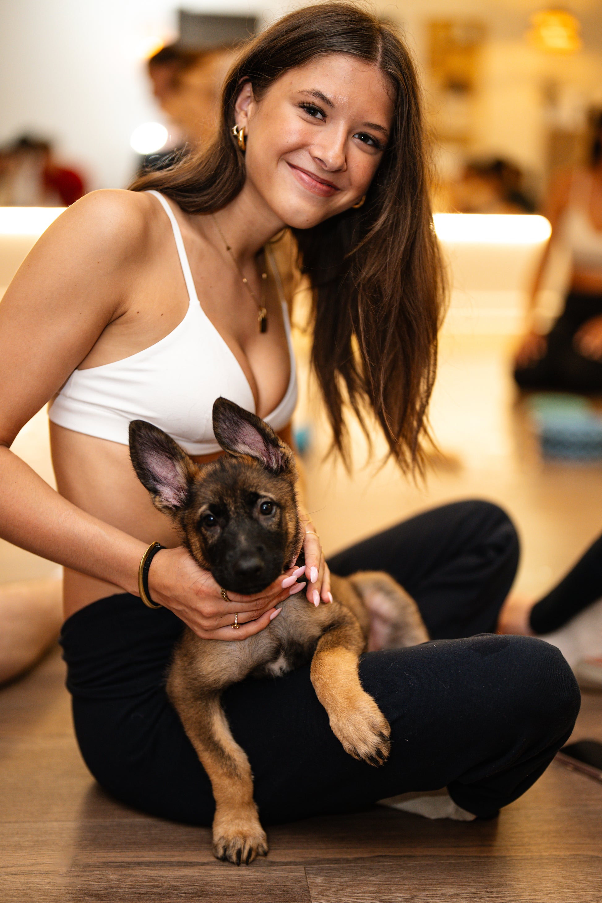 Participants and puppies during a puppy yoga session north of Montreal
